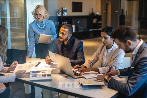 Consulting team reviewing business plans